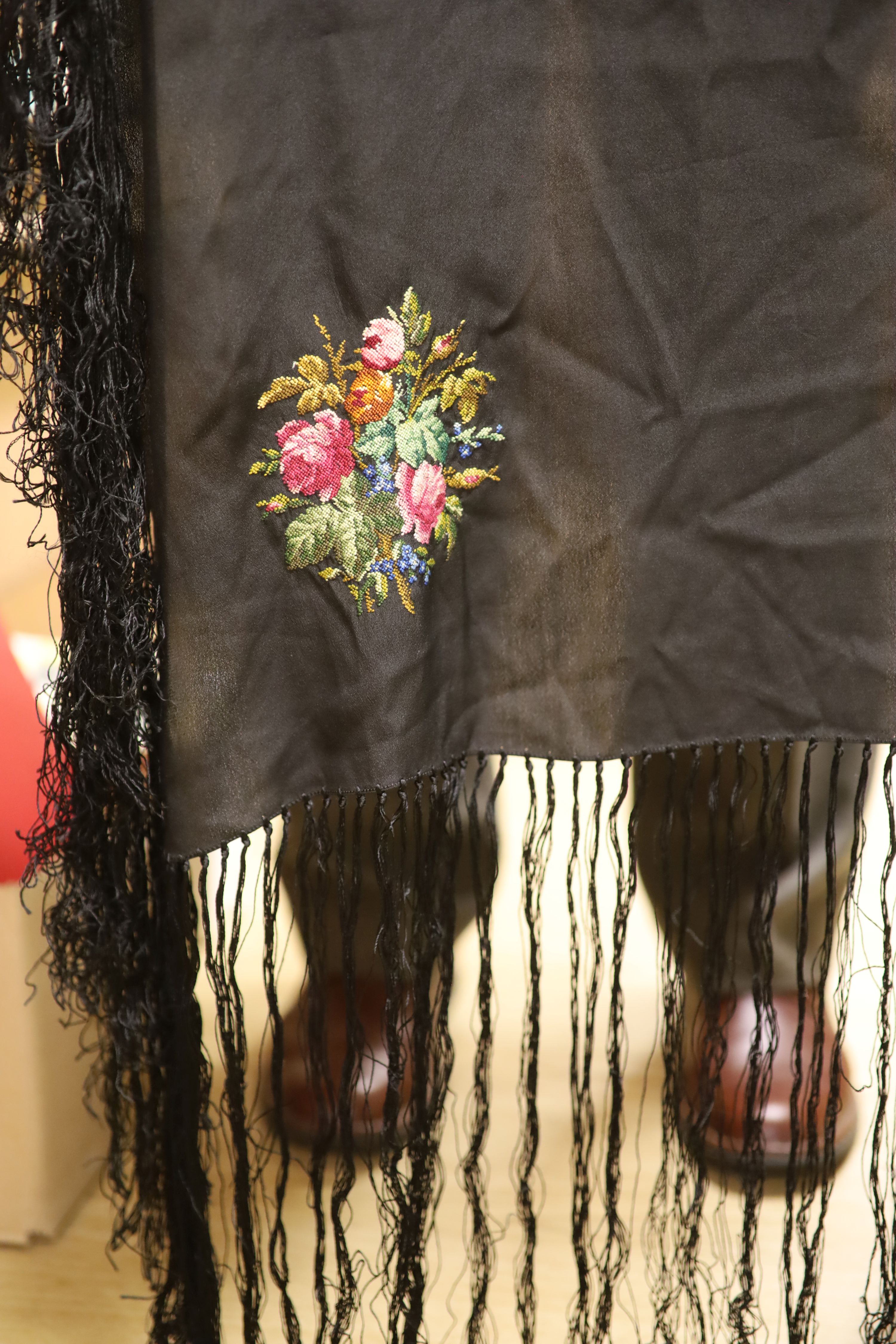 A Victorian black silk jacket and skirt, a child's white lawn dress, a black silk fringed petite point shawl and a fine silk shawl etc